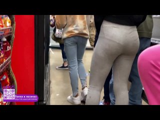 girl's butt in gray leggings spying in the store